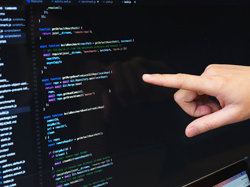 finger-pointing-at-javascript-code_4460x4460