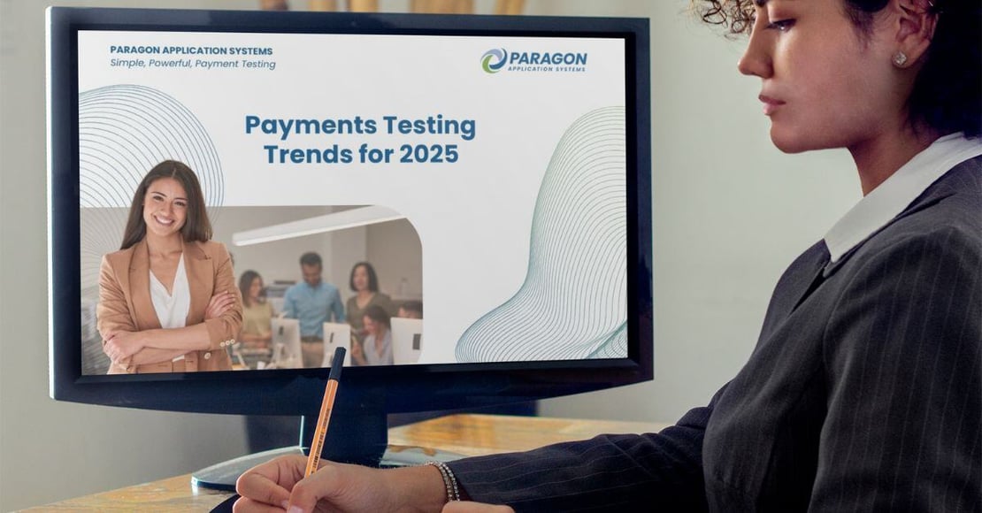 Woman reading the new Payments Testing Trends 2025 Guide on the computer