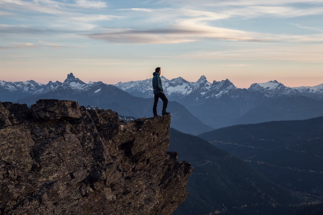 Man on mountain peak