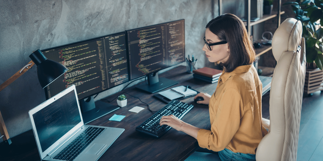 women-writing-code-at-her-desk