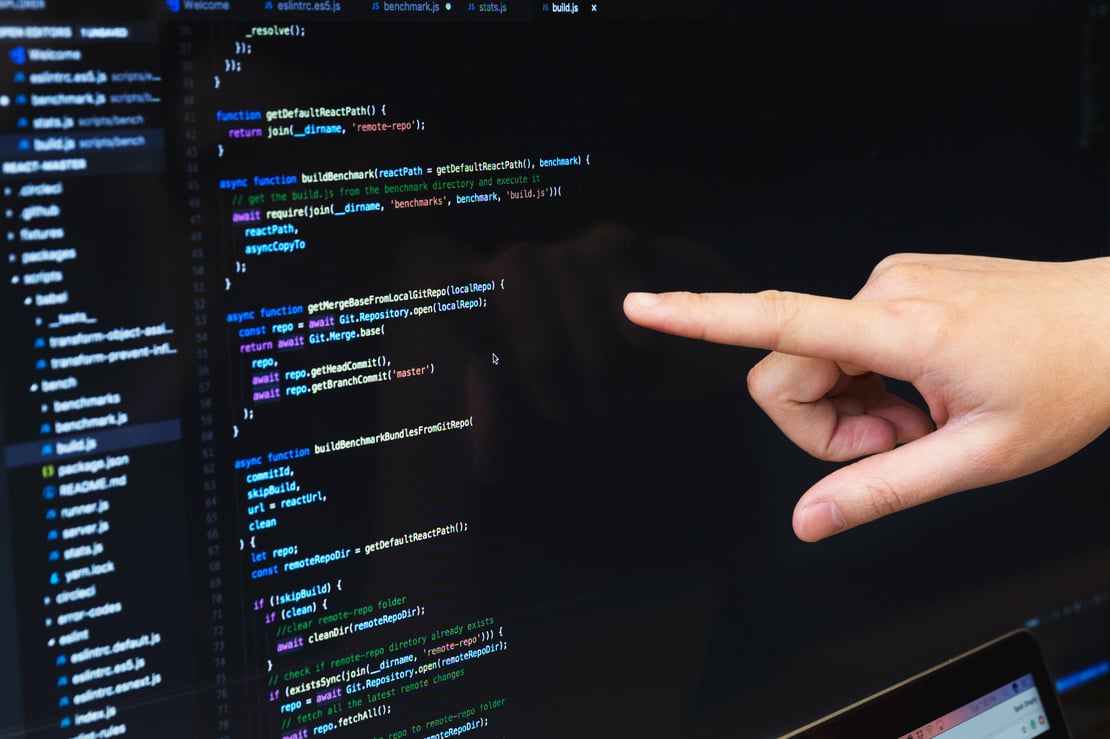 person-pointing-at-code